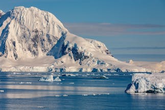 Mountain scenery on Cuverville Island in the Errera Channel of the west coast of the Antarctic Peninsula in Antarctica. Image Credit: By SteveAllenPhoto999, Envato Elements.