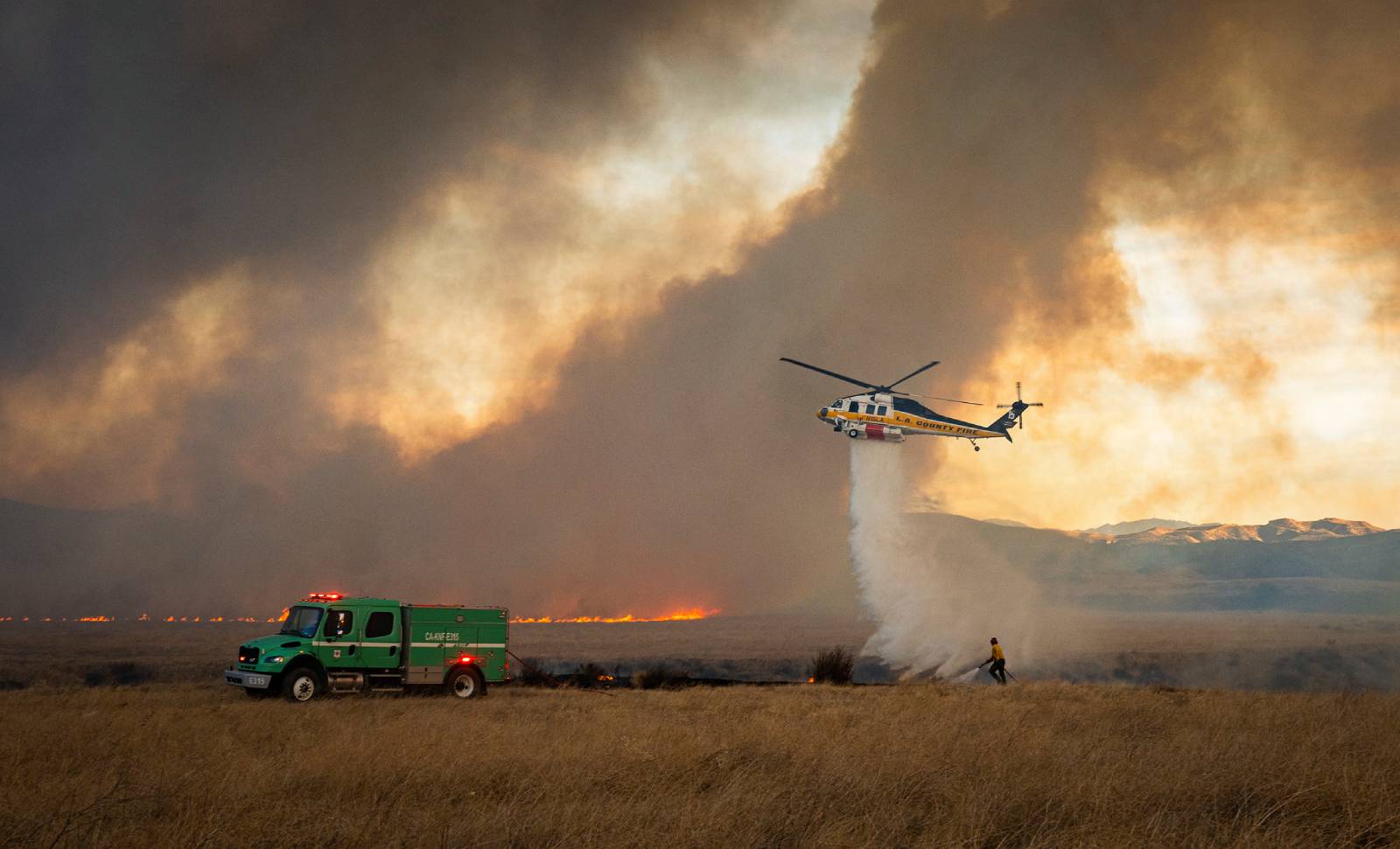 Firefighters fighting the Hughes Fire.