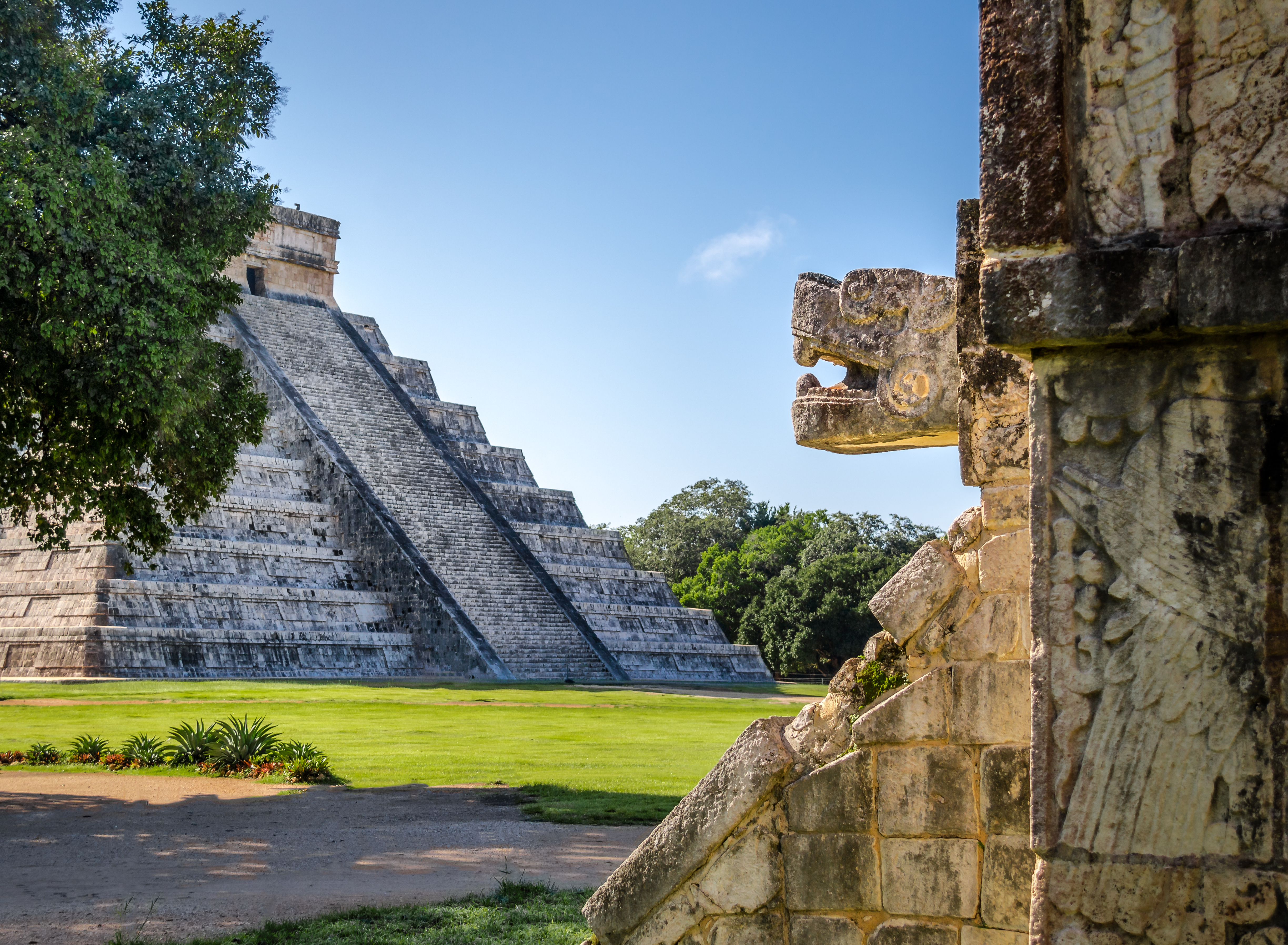 Jaguar head and Mayan temple pyramid of Kukulkan in Chichen Itza, Yucatan, Mexico. Image Credit: Diego Grandi, Envato Creative Commons.