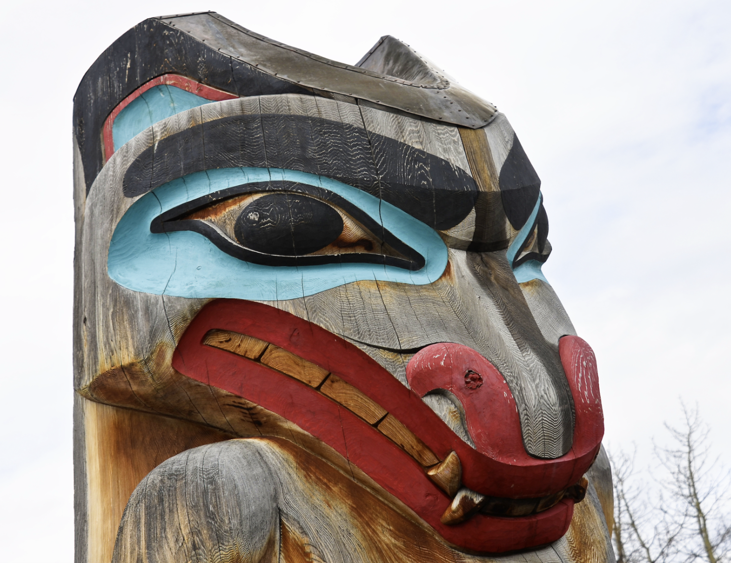 Close-up of wood carved wolf totem pole in Canada. Image Credit: © Reinhardt | Dreamstime.com.