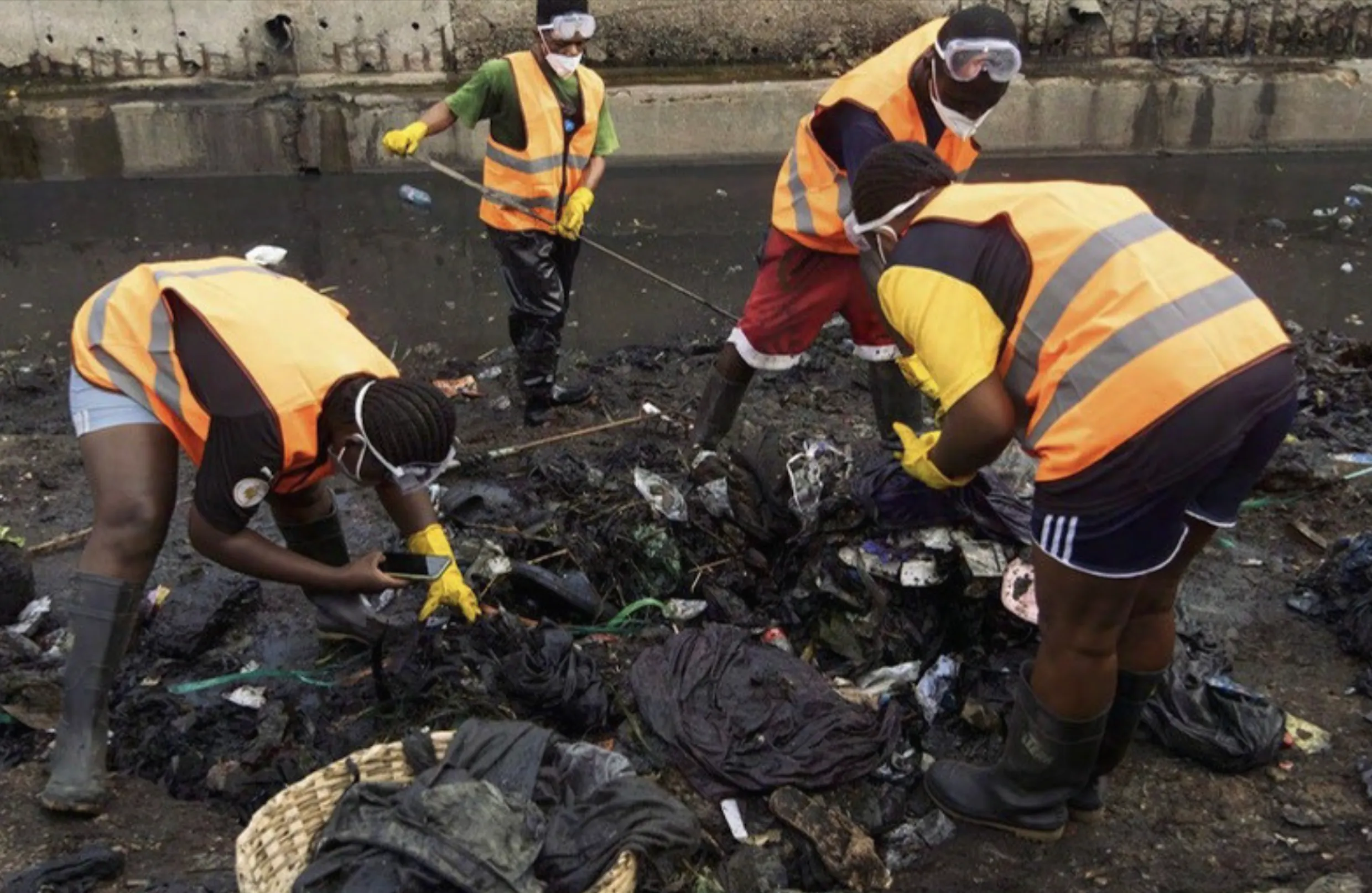 June Four Task Force members audit textile waste found in the canal. Image courtesy of The Or Foundation. June Four Task Force members audit textile waste found in the canal. Image courtesy of The Or Foundation.