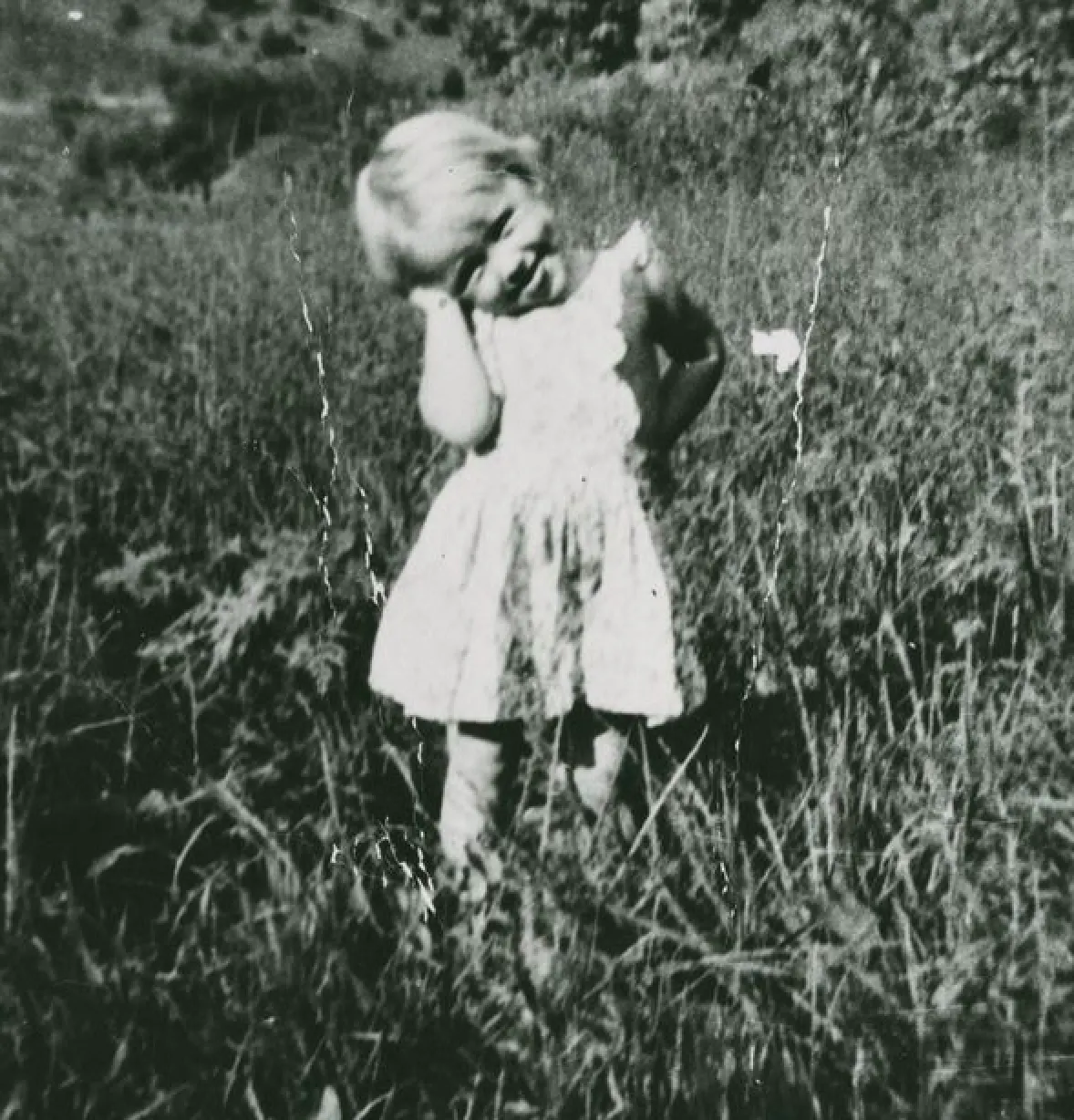A 3-year-old Dolly Parton growing up in the foothills of the Great Smoky Mountains. Image Credit: Chasing Rainbows, Tennessee State Museum.