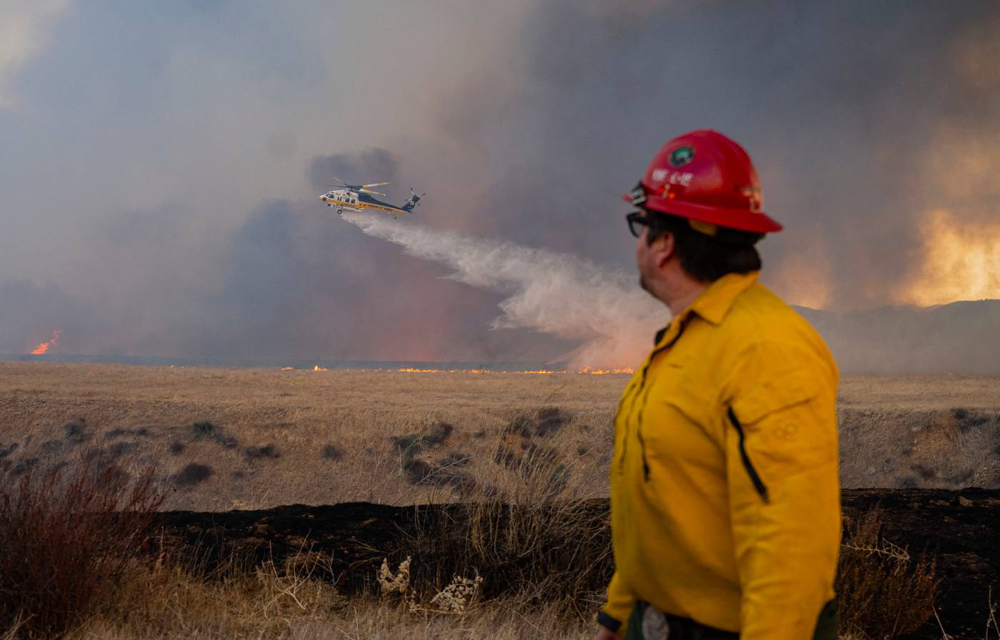 Firefighters fighting the Hughes Fire.