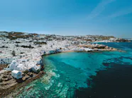 Greek Mykonos Beaches Soak Up The Sun On Psarou Beach In Mykonos