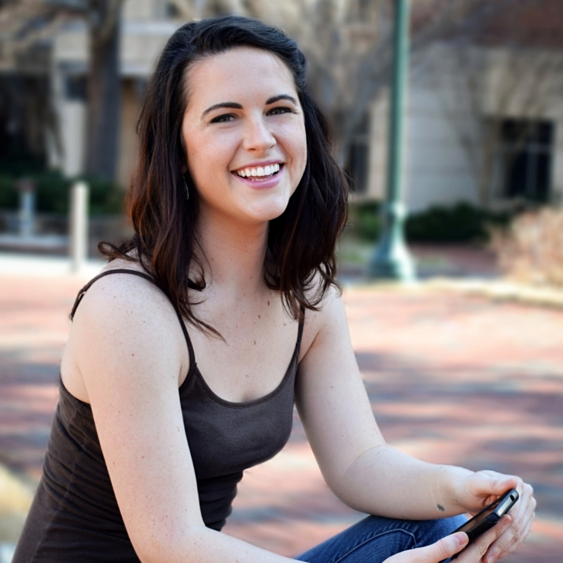 Image of Susanna Harris smiling and sitting outside