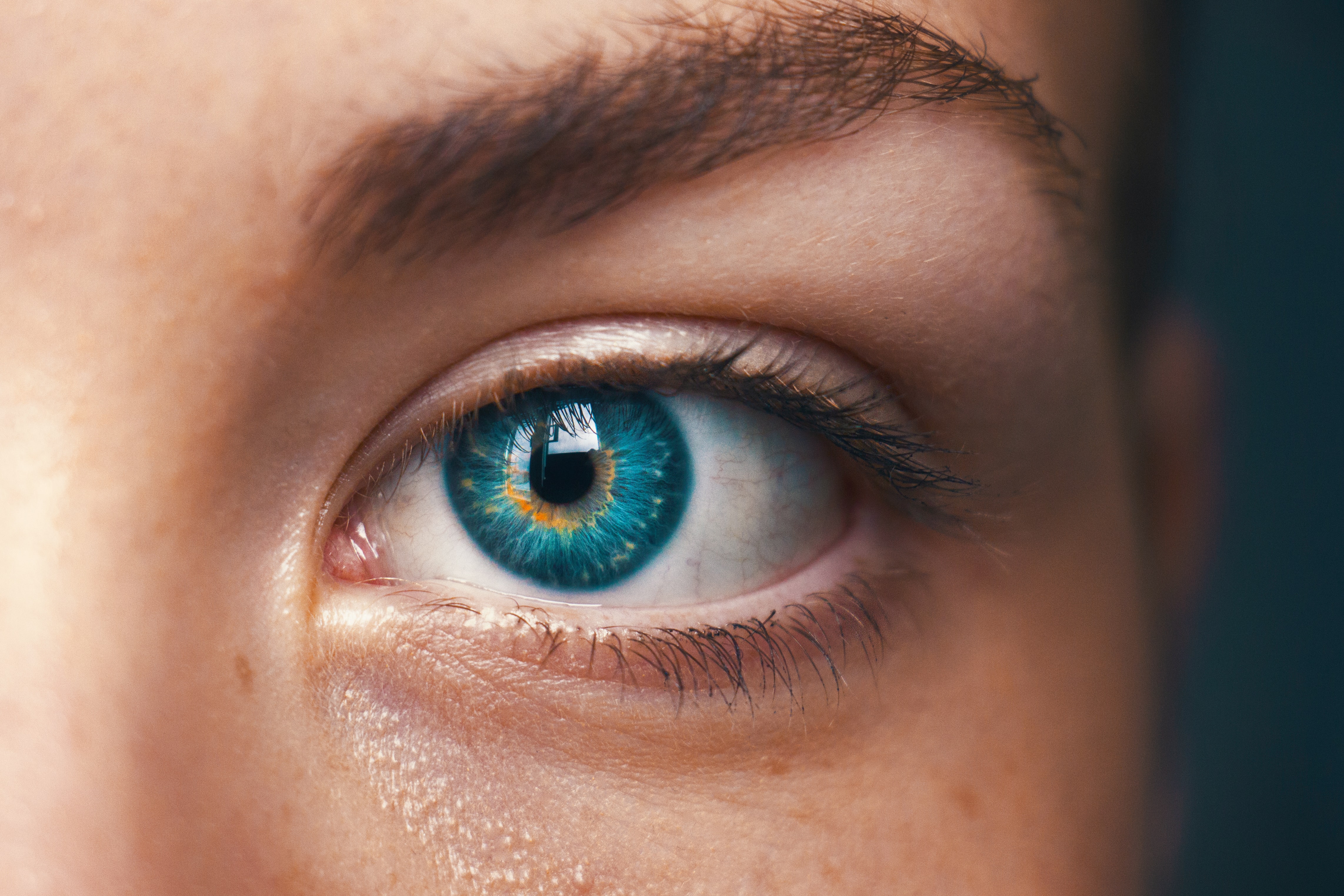 close up of a girl with a blue eye