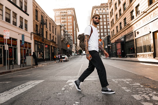 man walking a man walking in a city