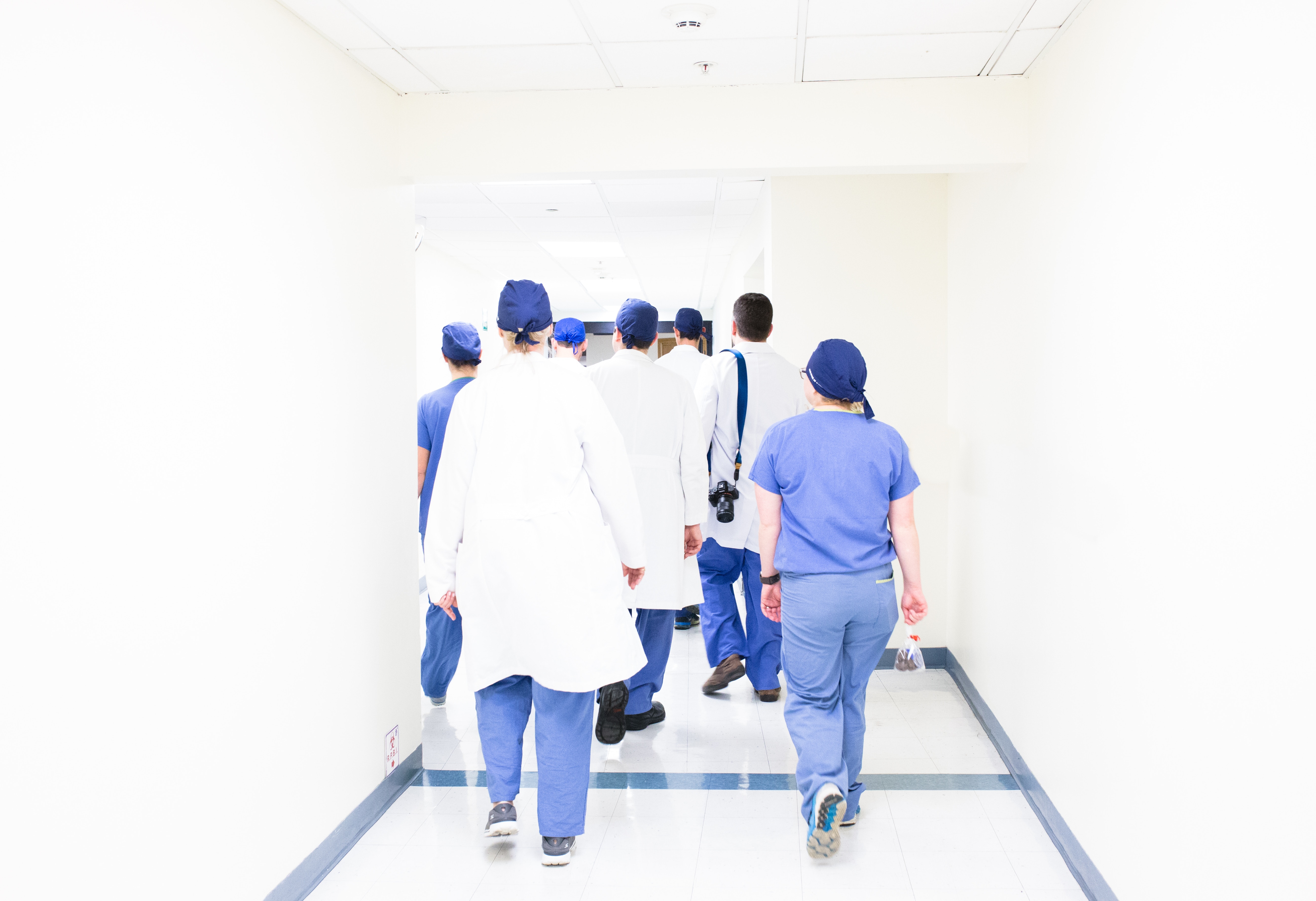 Doctors walking down a hospital hallway