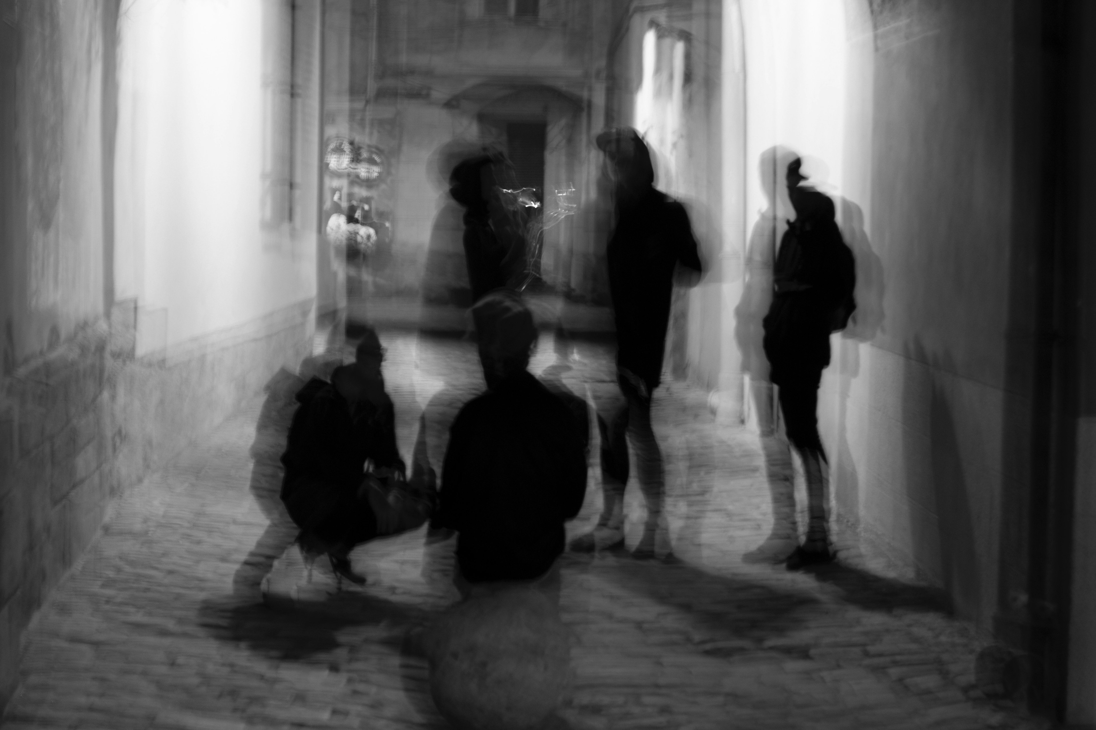 black and white photo of blurry human figures