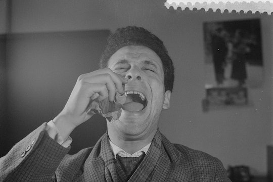Man holding back a sneeze Man holding back a sneeze