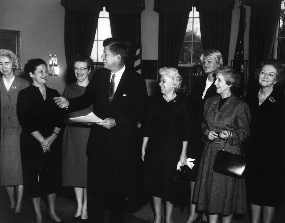 Nancy Grace Roman standing next to President John F. Kennedy, receiving 1962 Federal Woman’s Award