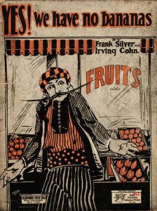 Cover of sheet music for "YES! We have no bananas," showing a man with a long mustache shrugging in front of a grocery display of fruit