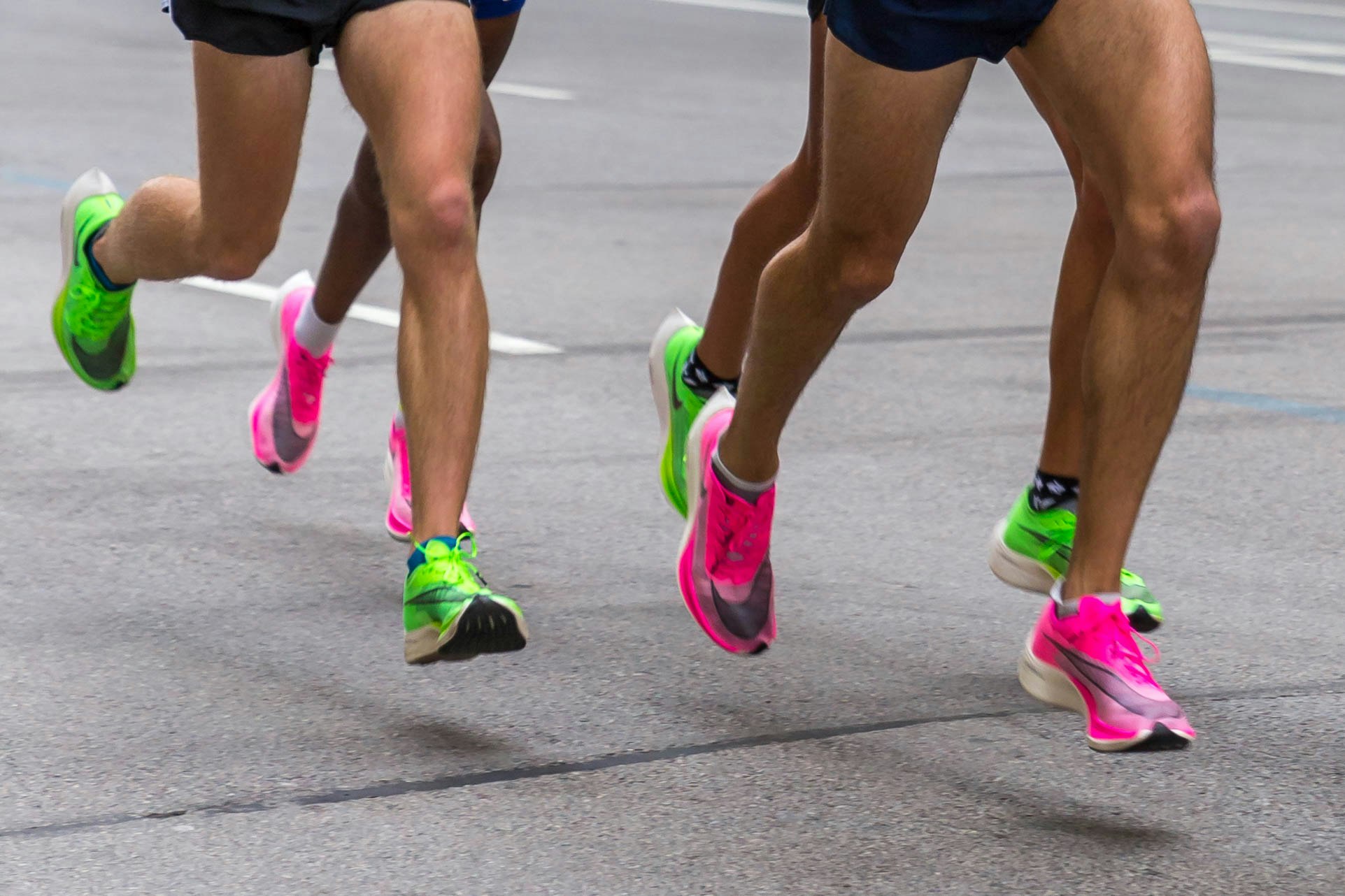 photos of bright pink and green running shoes