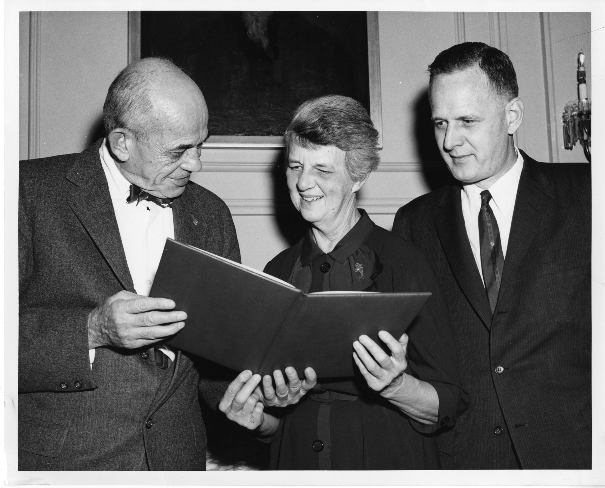 Walter Bauer, Rebecca Lancefield, and Macyln McCarty. Lancefield is receiving the T. Duckett Jones Memorial Award in October 1960. 