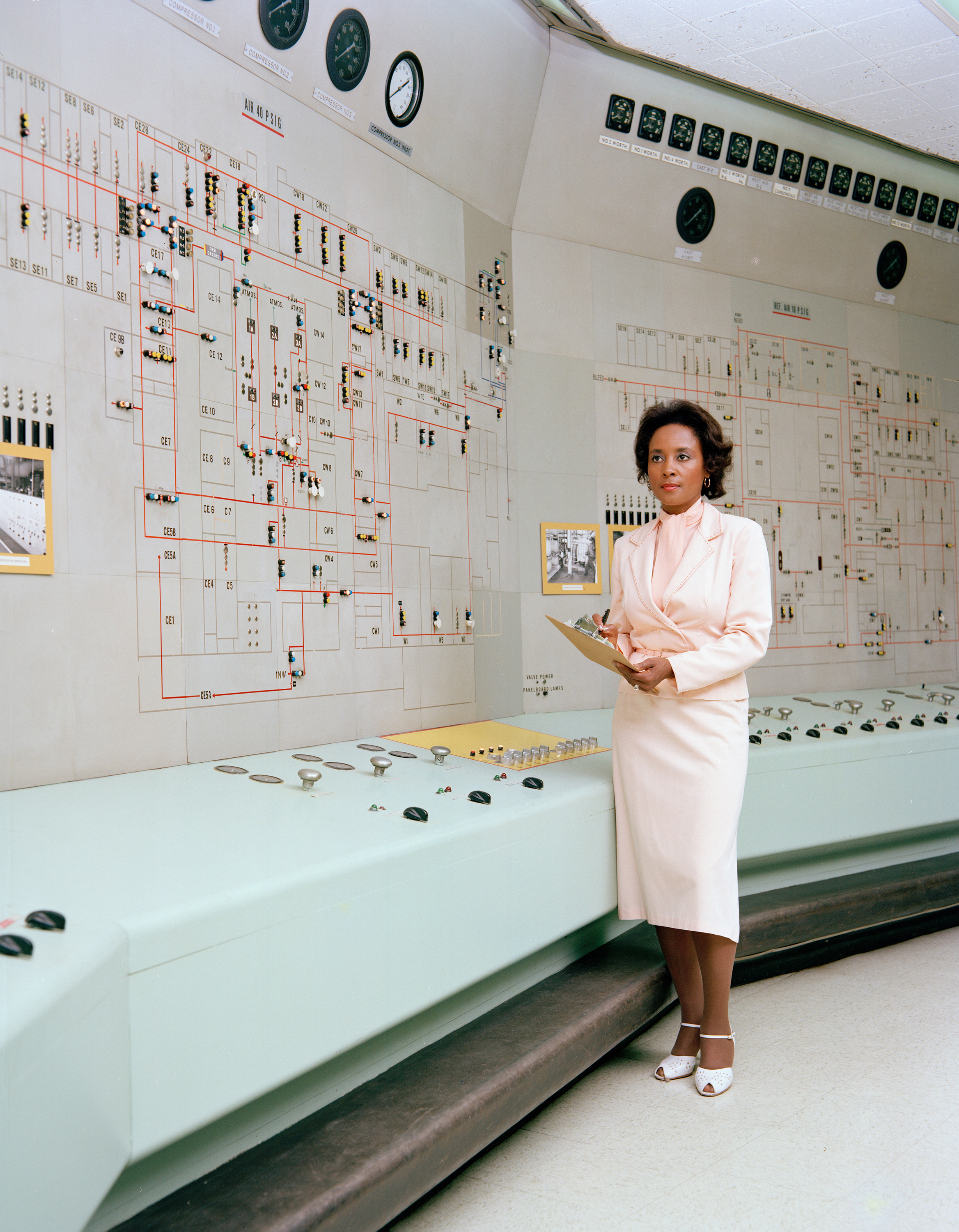 Annie Easley standing in a computer room