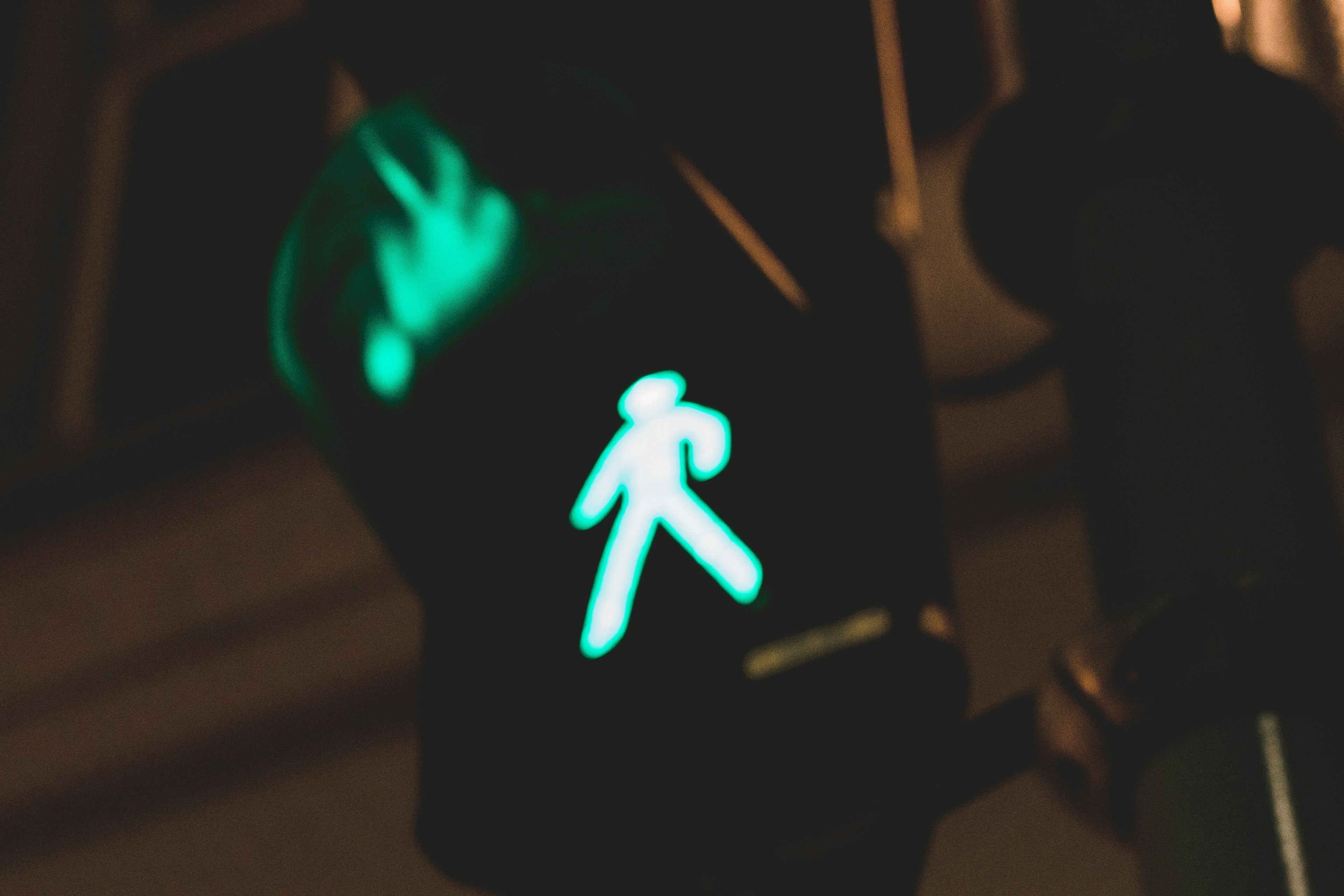 illuminated green pedestrian walk light at night
