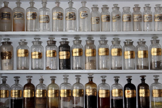 rows of jars with various substances in them on a shelf