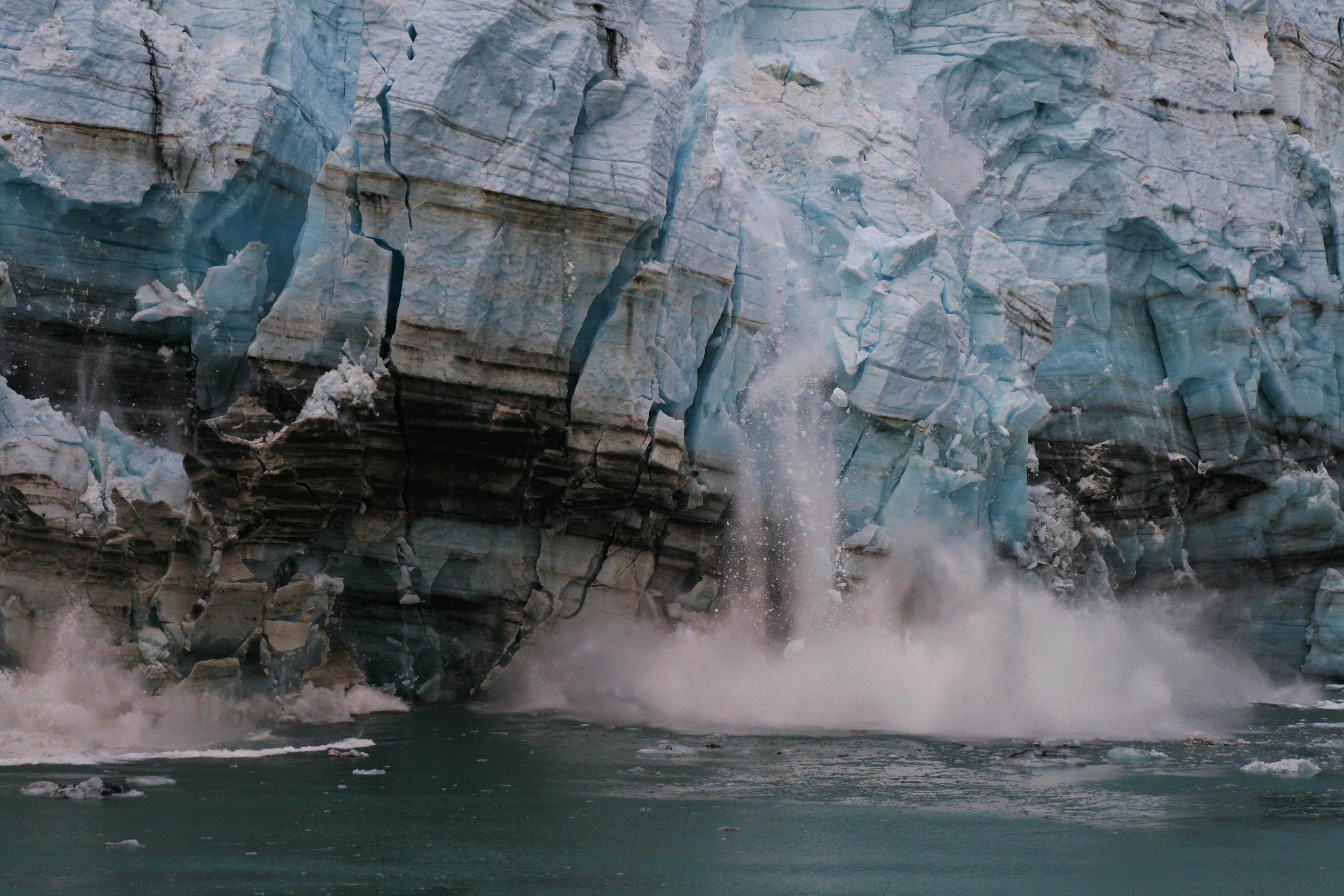 A calving glacier (a glacier melting and breaking)