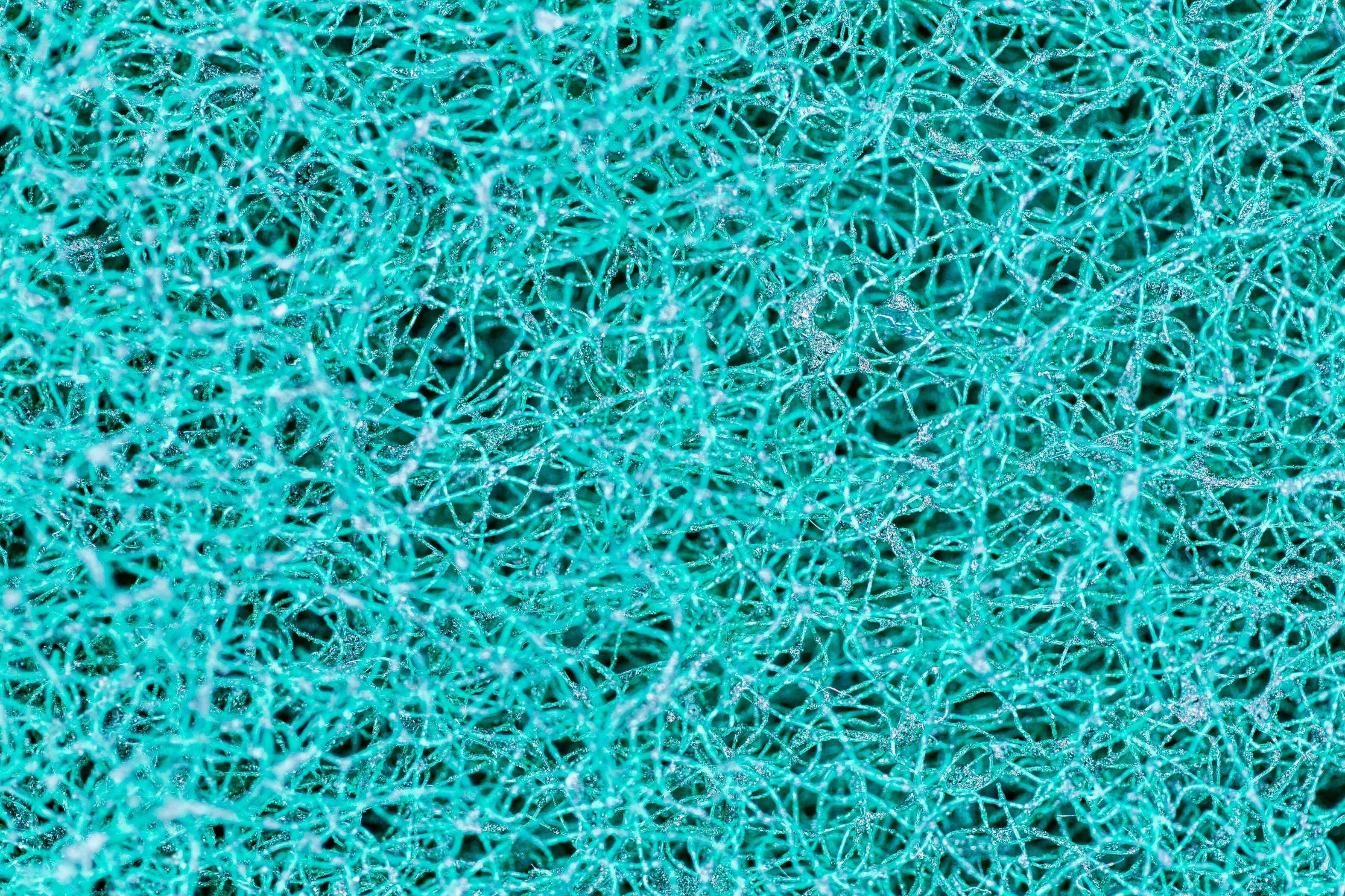 teal and black abstract tangled web of wires