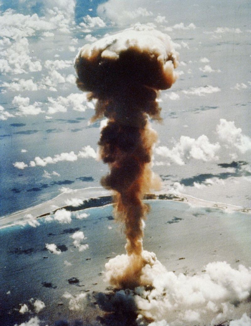 aerial photo of a dark cloud above the ocean