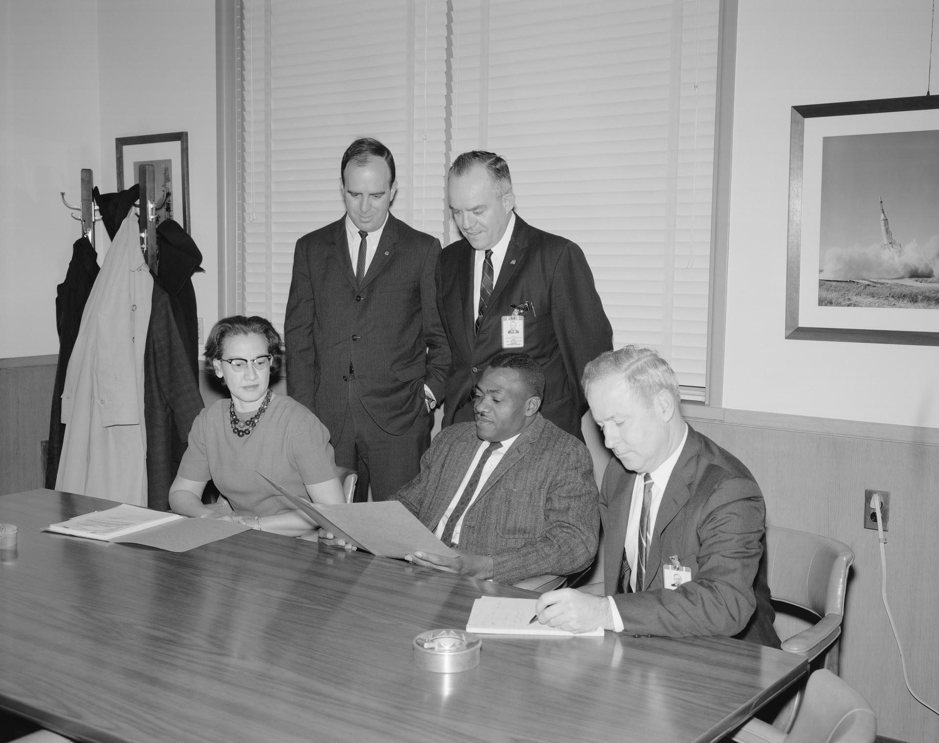 Seated from From Left: Katherine G Johnson, Lawrence W Brown, and J Norwood Evans, Employment Officer. Standing from Left: John J Cox, secretary; and Edward T Maher
