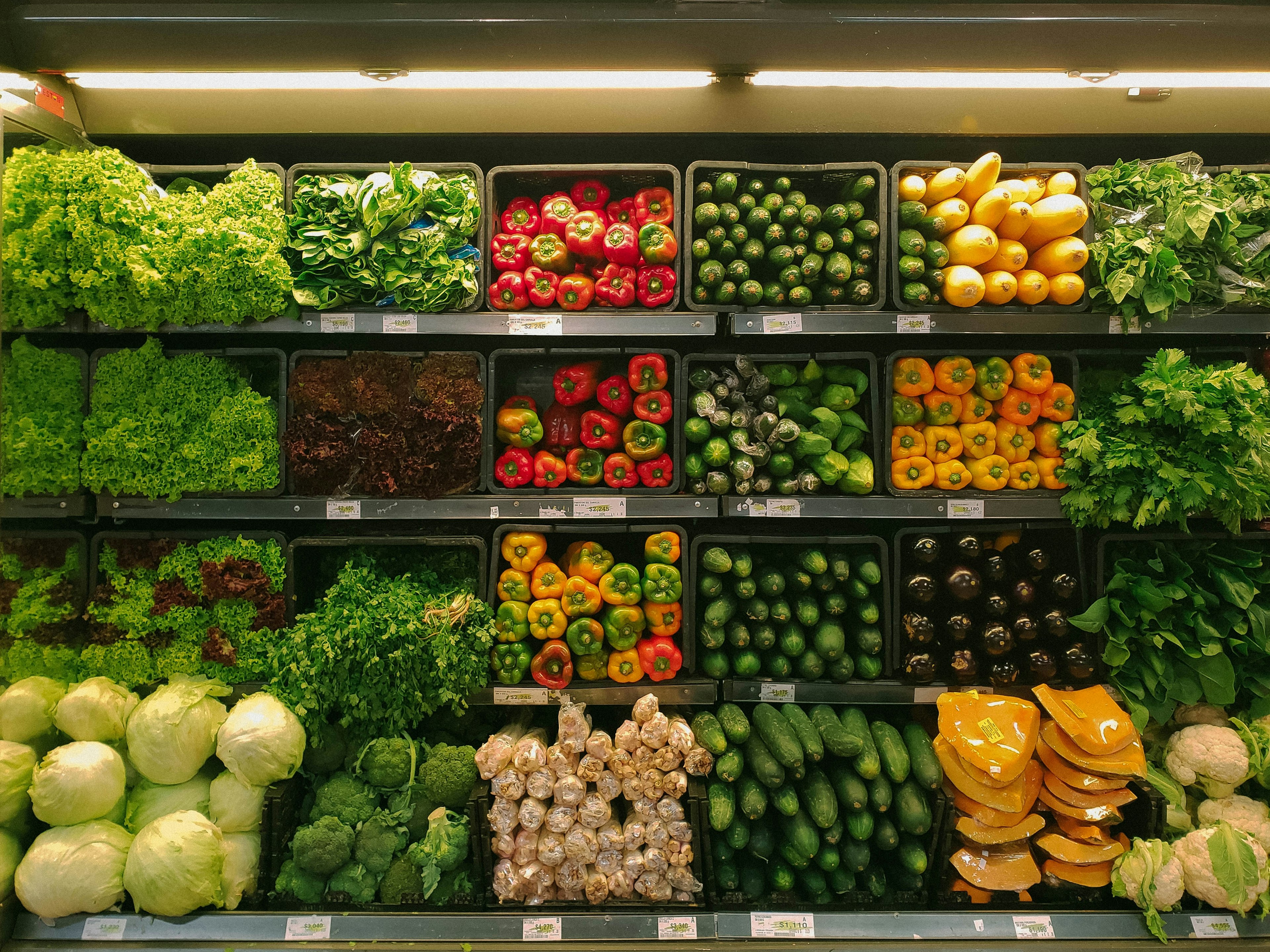 grocery store shelves full of vegetables