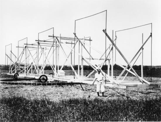 Jansky with his antenna, which was more than 100 feet long and 20 feet tall and rotated on four Ford Model-T wheels