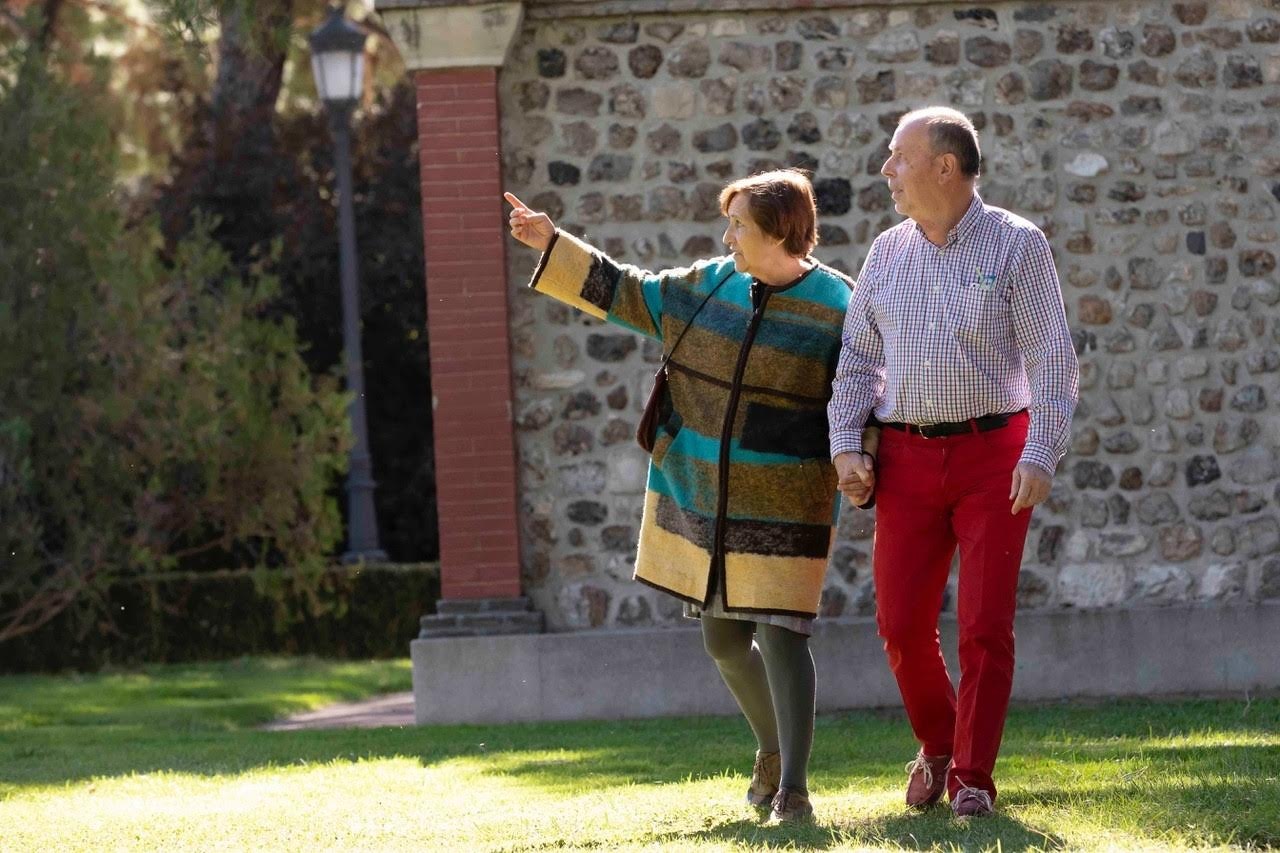 Alicia Del Blanco and Armando Guerra take a daily walk in El Retiro park in Madrid, Spain
