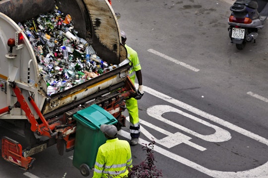 Garbage truck filled with plastic bottles