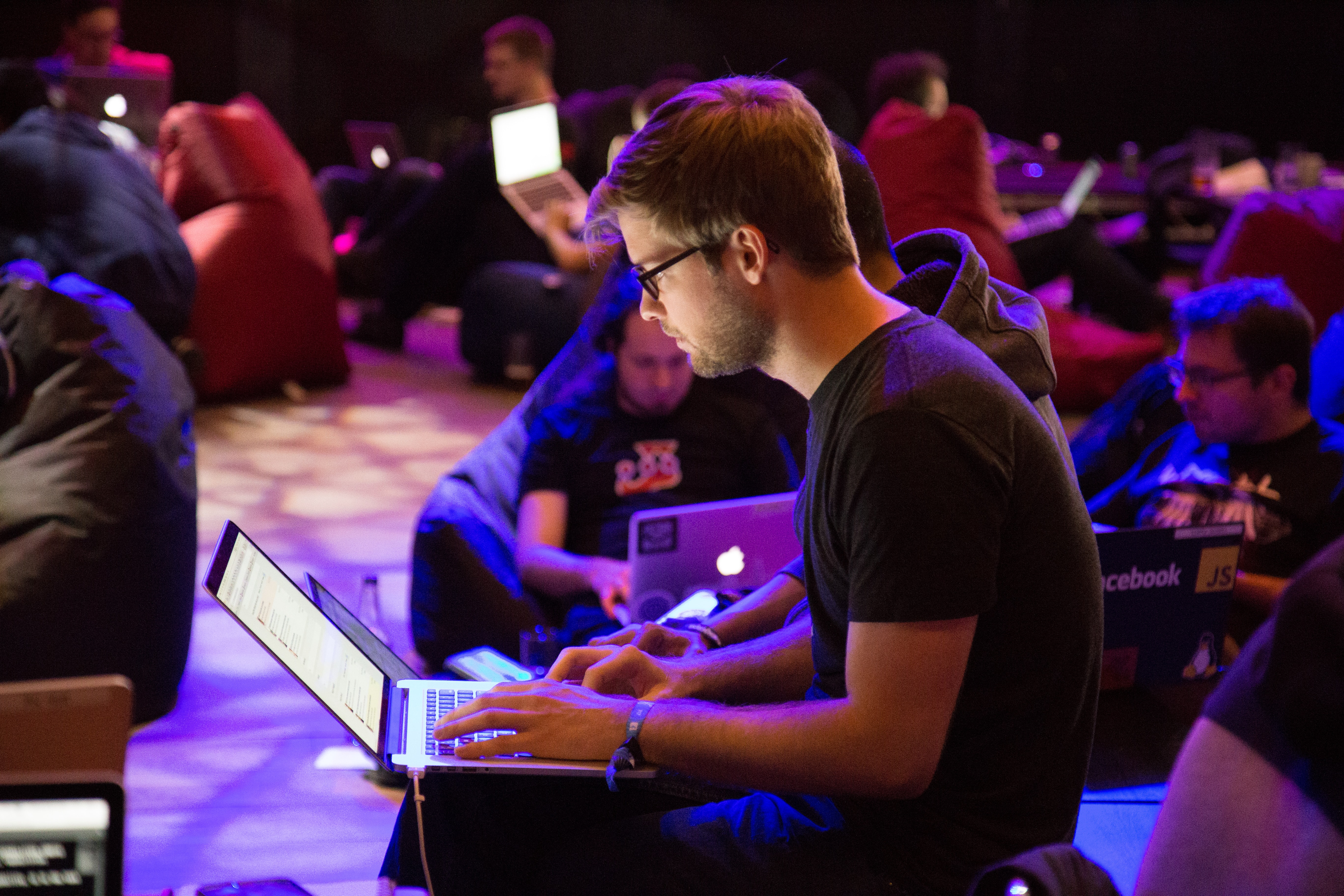 A person using a laptop at "Hackathon" UK