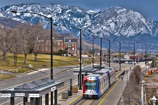 train trax train in salt lake city against a mountain backdrop