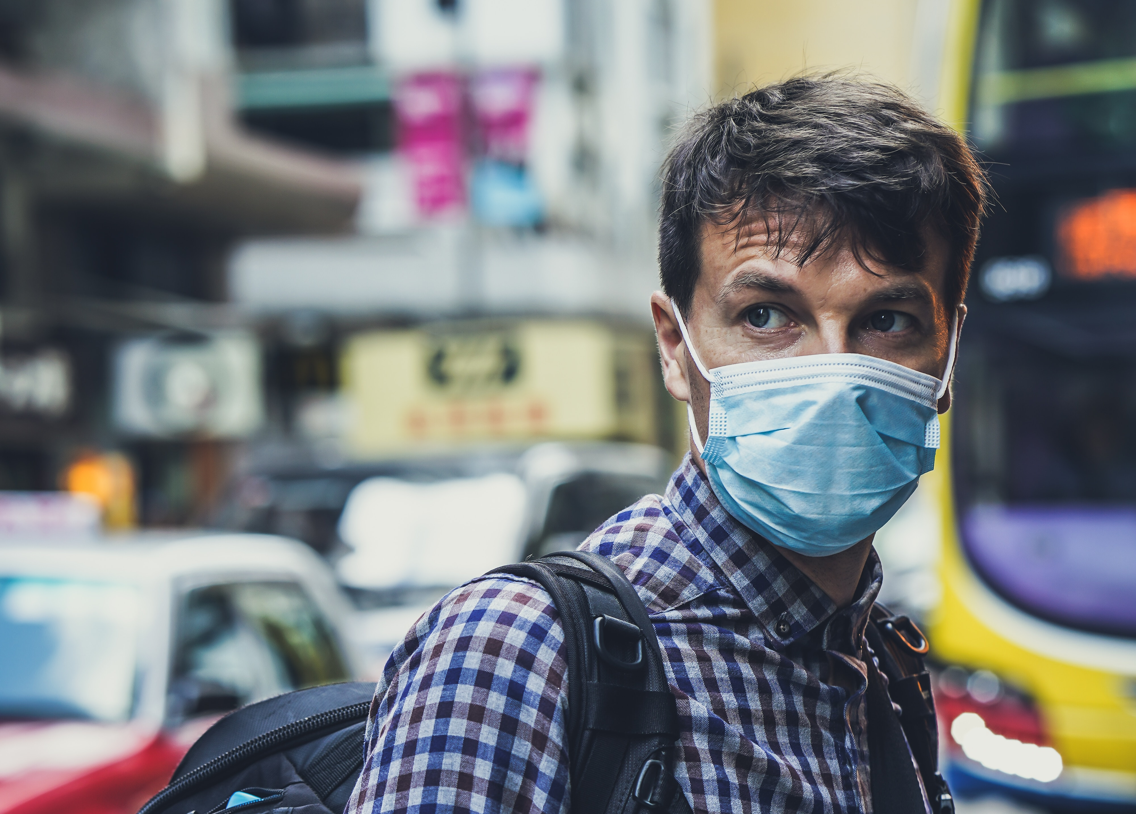 A man wearing a facemask to protect himself from viruses or bacteria, like coronavirus.
