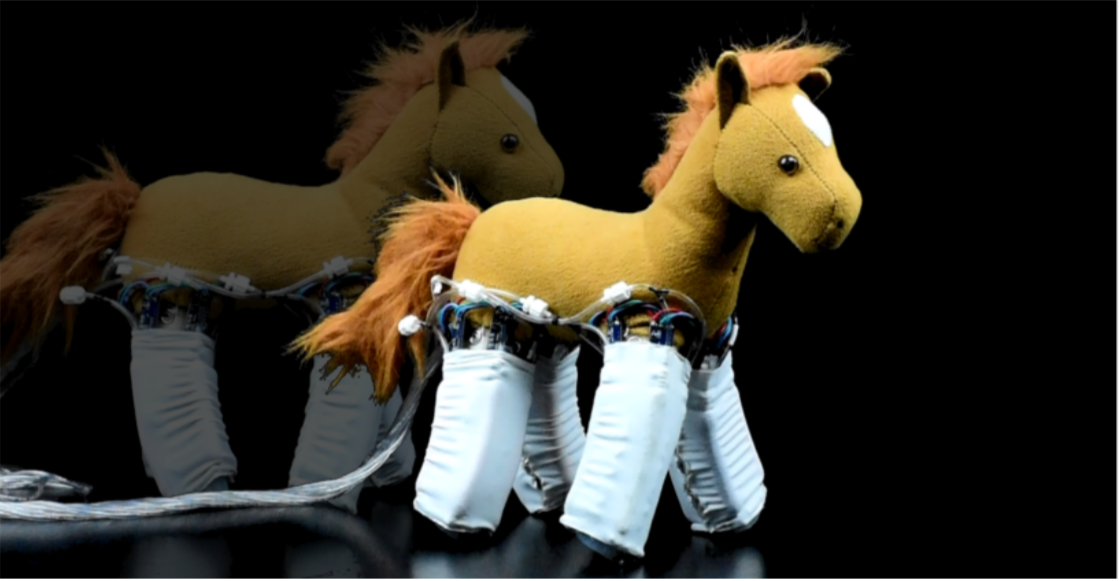 A soft child's horse toy with robotic skin around it's legs