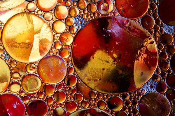 an abstract of gold and brown bubbles of different sizes