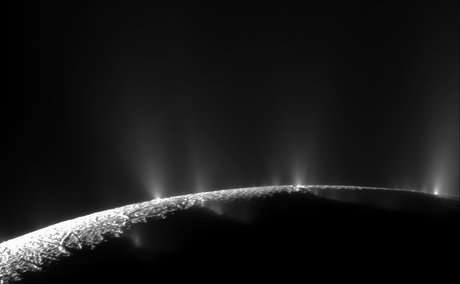 Geysers erupting on the surface of Enceladus, photographed by Cassini
