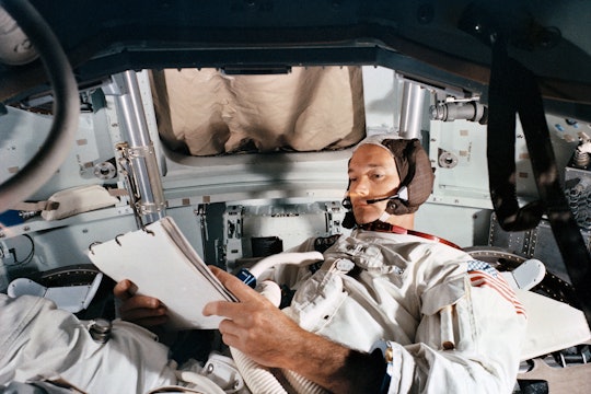 Command Module pilot Michael Collins practices in the CM simulator on June 19, 1969, at Kennedy Space Center.