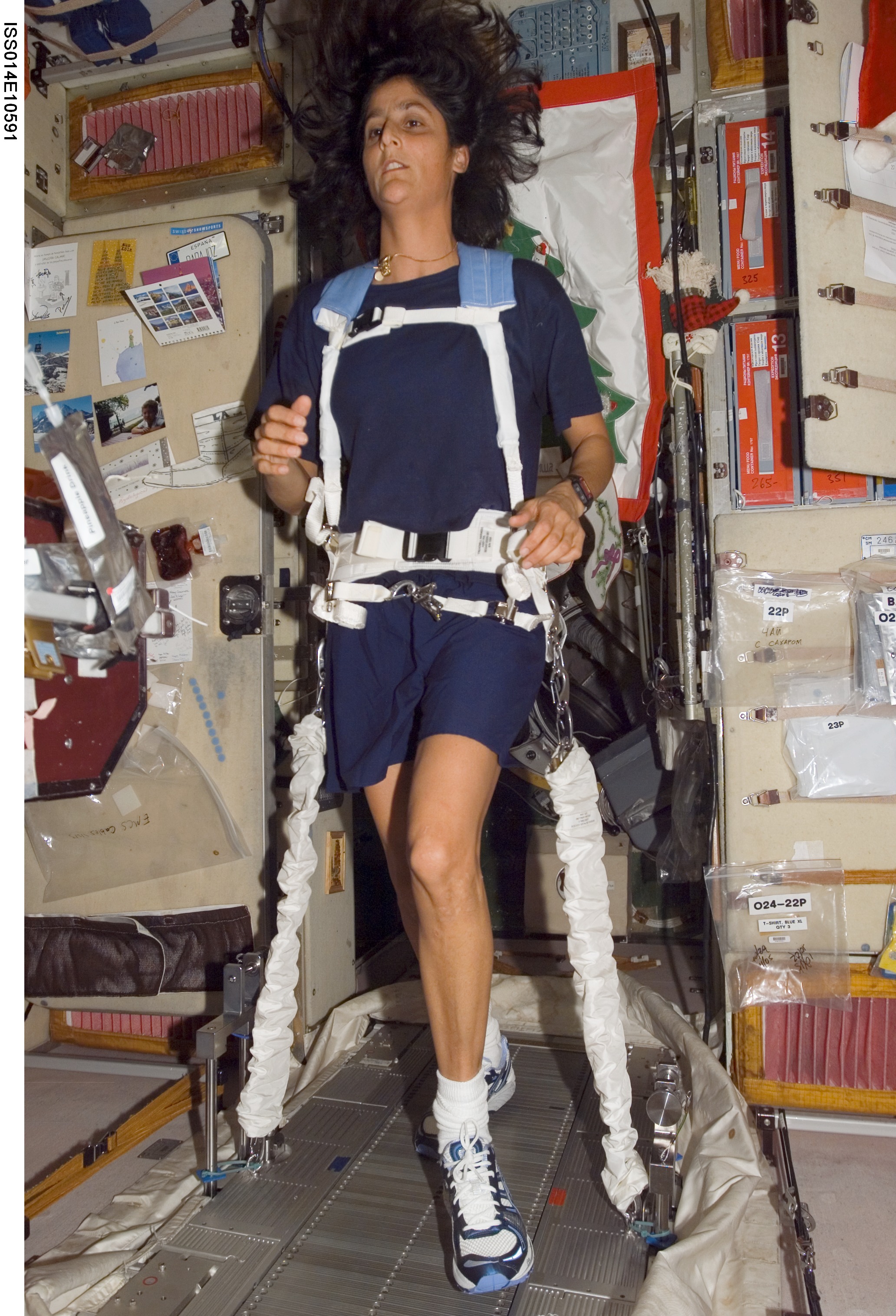 An astronaut exercising in space