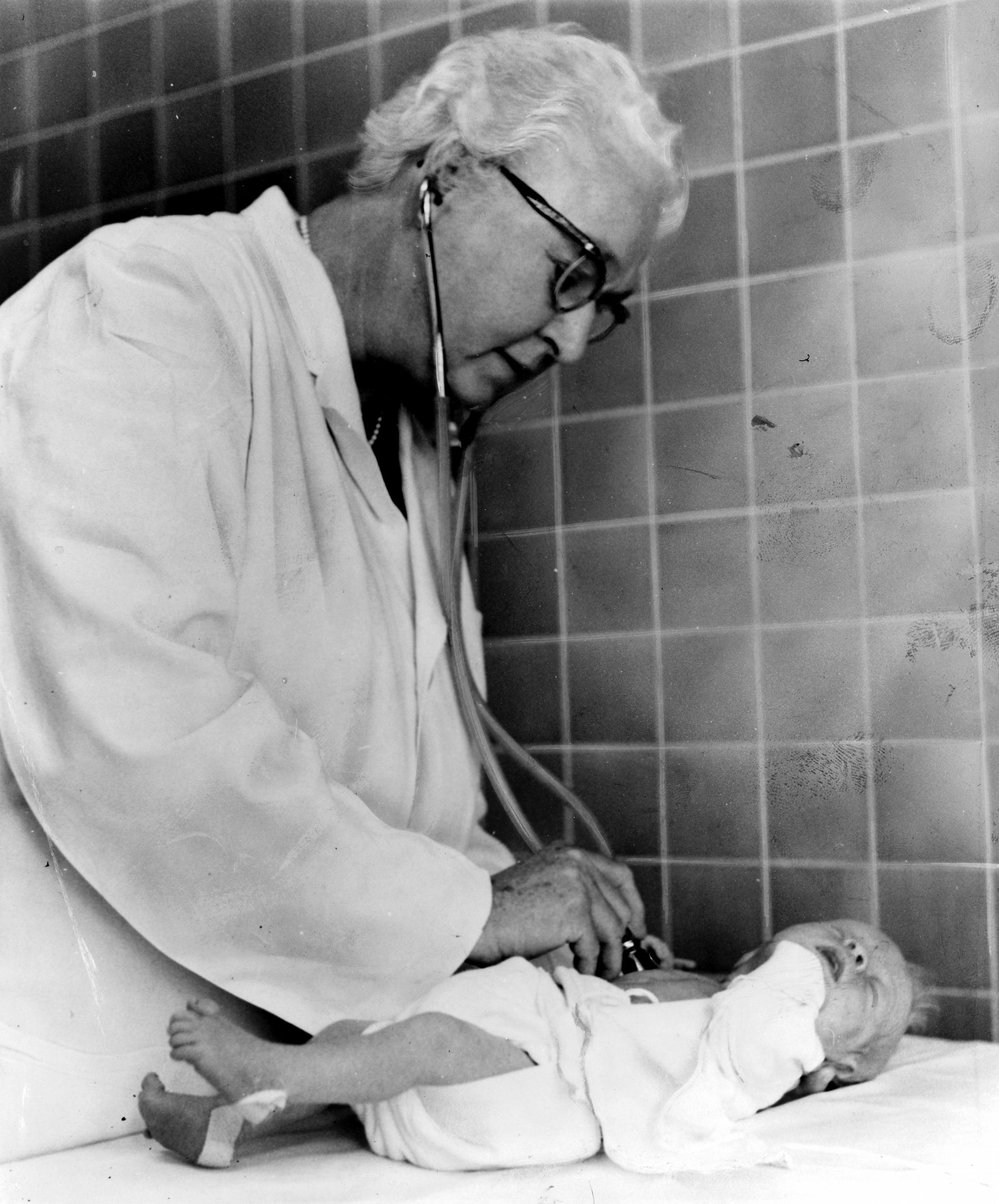 Virginia Apgar examining a newborn