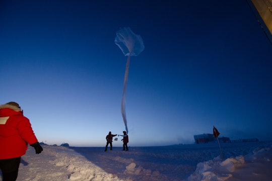 NOAA scientists releasing an ozonesonde (weather) balloon