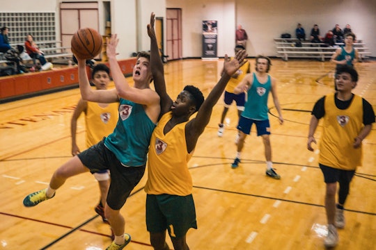 youth basketball kids playing basketball in a gym