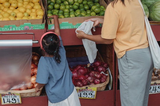 picking fruit at grocery store