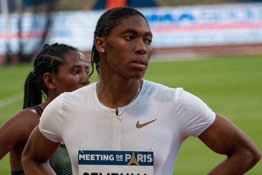 A picture of Caster Semenya after a race in Paris, standing with hands on her hips.